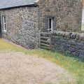 Looking along the rear of the house after some grass laid.